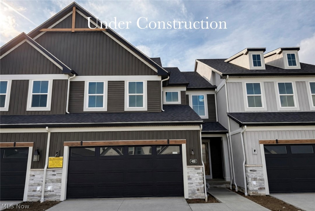 Beautiful 2-story townhome ready for Summer move-in! This brand new plan welcomes you with a dedicated 2-story foyer, luxury vinyl plank flooring throughout the first floor, and 9' ceilings throughout. The kitchen features a 7.5' quartz island, walk-in pantry, upgraded appliances with range hood, and ceiling-height soft-close full-overlay cabinetry with hardware. The dining area opens onto an expanded 10 x 17' patio, making indoor-outdoor entertaining a breeze. Open to the great room, owners will enjoy the view of the cozy fireplace. A spacious powder room with vanity cabinet and laundry room, complete with utility sink, wrap up the first floor. Wrought iron spindle railing leads to the 2nd floor, where you'll find the oversized primary suite with spacious sitting area, tray ceiling, and ensuite bath that boasts an 11.5' walk-in closet, tile shower, separate linen closet, dual quartz vanities, and private water closet. Two additional bedrooms, each with walk-in closets, and a full bath, complete the 2nd story. The full basement with 9' ceilings and rough-in plumbing is perfect for storage or future finishing, and the 2-car attached garage provides for easy coming and going. Low-maintenance living means snow removal and lawn care are done for you, adding valuable time back to busy schedules. Protected conservation area, sidewalks and street lamps, and a community pond with fountain add to the appeal of this thoughtfully designed neighborhood. Ideally situated just 25 minutes from downtown Cleveland and Akron, minutes from the Metroparks, Blossom Music Center, golf courses, the new Valor Acres, and directly across from beautiful Michael Angelo's Winery, this prime location is ideal for those who enjoy a recreational lifestyle. Photos are of actual home, those showing furniture are virtually staged.