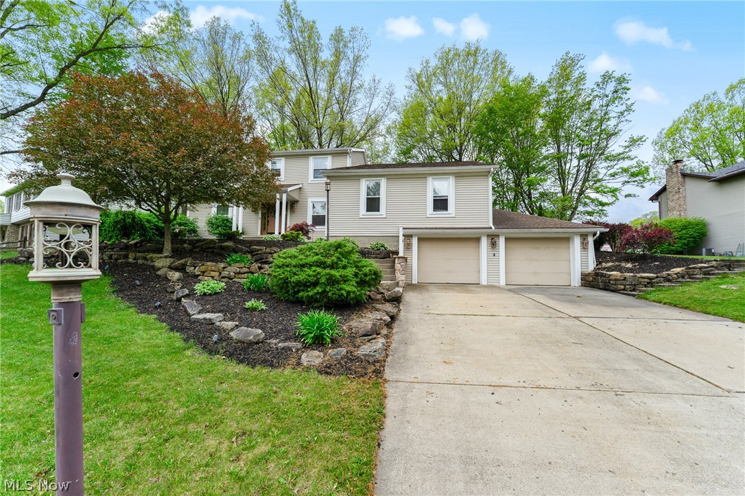Welcome to 510 Stoneybrook Lane in Canfield, a home that truly has the space, layout, and updates everyone is looking for. With 4 bedrooms, 3.5 bathrooms, and over 2,800 sq ft, this home offers room for everyone. The kitchen is definitely one of the standout spaces in this home. It features granite countertops, stainless steel appliances, an oversized island with a built-in wine rack, tons of cabinet and counter space, and updated lighting throughout. The layout flows perfectly into the main living area, making it ideal for entertaining or everyday living. Sliding doors lead directly out to the back deck overlooking the private wooded backyard. This home also offers multiple living spaces, including a front sitting/living room right when you walk in, plus a large great room featuring a floor-to-ceiling brick fireplace, skylights, custom built-ins, and wood beam ceilings that make the whole space feel warm and inviting.
The first-floor primary suite is HUGE and offers more than just a bedroom. There’s plenty of room for a sitting area, oversized furniture, or even a private retreat space of your own. It also includes a walk-in closet and a large bathroom with both a jetted tub and separate shower. You’ll also find a first-floor office and first-floor laundry, adding even more convenience to the layout. Upstairs, you’ll find another massive bedroom with its own full bath that could easily function as a second primary suite. There are also two additional bedrooms and another full bathroom upstairs, giving everyone their own space. There’s also a partially finished basement, tons of storage, and major updates already done including the roof, furnace, A/C, windows, and water heater.