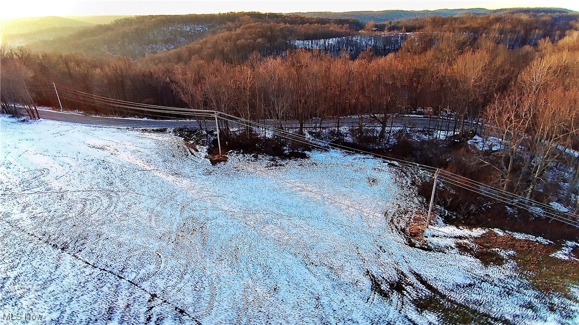 Set in a peaceful county setting, this 98-acre unimproved property spans two parcels and features rolling hills, a blend of open fields and wooded acreage, and abundant natural beauty. Well suited for hunting, outdoor recreation, or future development, the land offers both privacy and versatility. Whether you envision a private hunting retreat or the perfect backdrop for building your forever home, this property provides the space, serenity, and long-term potential to bring that vision to life - away from the everyday hustle and bustle. Seller is open to selling parcels individually, offering either the 72-acre parcel or the 26-acre parcel to accommodate buyer needs.
 Please note that this acreage does not include the adjacent pond area, which is approximately 2 acres in size. The pond will be excluded from the sale and will be separately parceled off prior to closing.