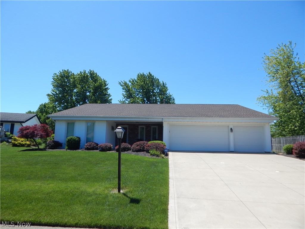This single floor ranch home offers over 2,200 sf of living space.  Home has 3 bedrooms, 2 1/2 full baths and a 3 car garage.  Enjoy the modern open setting with living to dining room transition.  Eat-in Kitchen has been updated with granite counter tops and dark cabinetry. Family room offers a beautiful brick fireplace and wet bar for your entertaining. Home also has option of office or 4th bedroom. Sliding doors take you to the massive 30 x 40 deck.  Nice size backyard with a shed.  Large master bedroom offers a private master bathroom.  His and her closets. Community Pool.  Move-in condition.