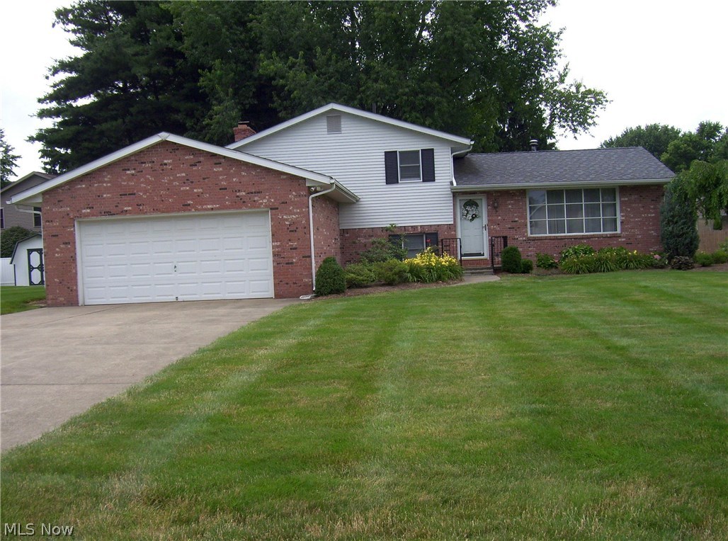 Lovely 3 bedroom, 2 full bath split level in established neighborhood. Laminate flooring on two levels. Upgraded baths; stainless appliances in kitchen; updated mechanicals: electric panel in '18, furnace & A/C in 2011, water heater in '09, roof in '08. Large deck; professional landscaping; neutral colors; firepit. Neat and clean; pride of ownership throughout. Home Warranty Included!