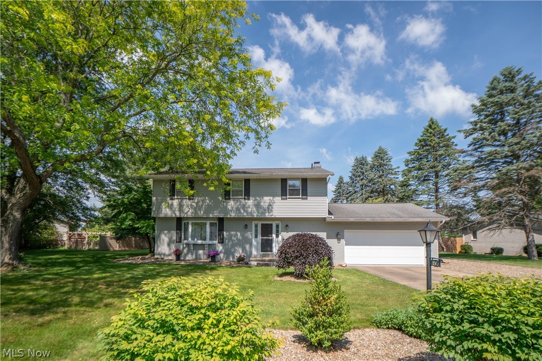 Located in the desirable Whispering Meadows neighborhood, this spacious Uniontown colonial offers the room, comfort, and outdoor space families are looking for. A welcoming foyer with hardwood floors, wood stairs, and a coat closet opens to a formal living room with a bay window, creating a bright and inviting first impression. The eat-in kitchen offers plenty of cabinet storage, stainless steel appliances, a breakfast bar, and a dining area with sliding doors leading to the back patio for easy everyday living and entertaining. Just off the kitchen, the cozy family room features exposed wood beams, a unique textured ceiling, and a gas fireplace that can also be used as wood burning, giving the space a warm lodge-like feel. A convenient half bath and three-season sunroom with multiple sliding doors overlooking the backyard complete the main level. Upstairs, you’ll find a full bathroom and four comfortable bedrooms with good closet spaces, including a spacious primary bedroom with a walk-in closet and private bath with tile shower. The partially finished lower level adds even more flexibility with a rec room, bonus room, storage area, laundry, and utilities. Outside, enjoy two concrete patios, a storage shed, and a generous .53-acre yard with plenty of room to relax, play, and gather. A wonderful place to call home!