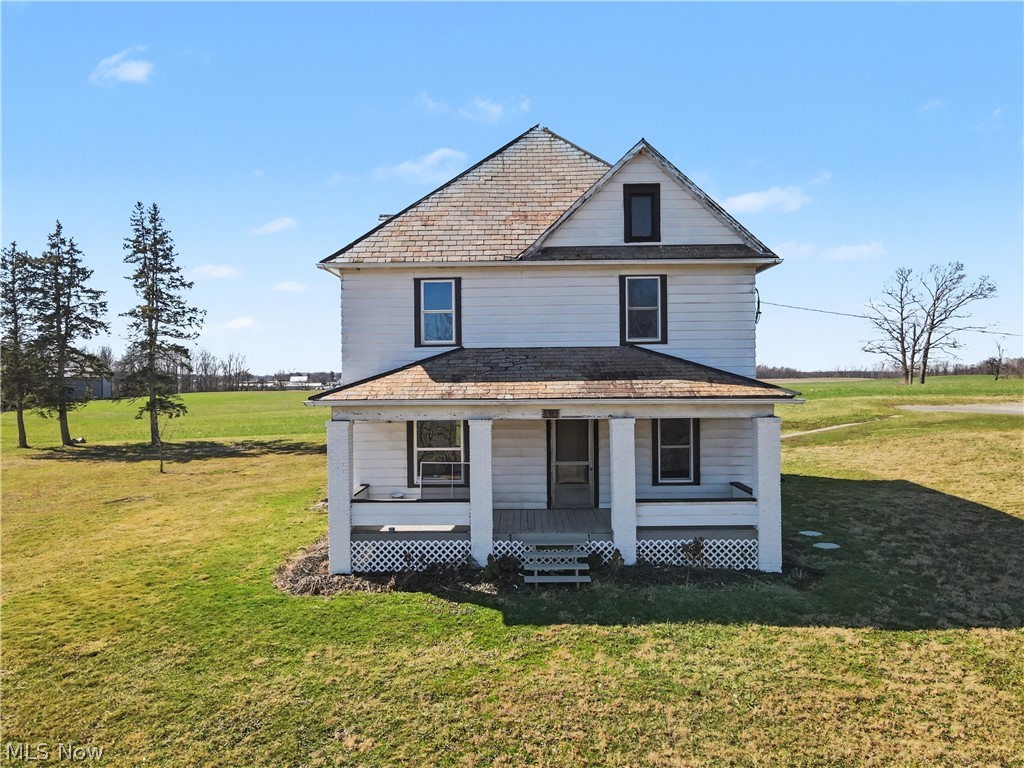 Charming farmhouse-style home set on approximately 2.6 acres just outside of Alliance. Enter into this home through a beautiful foyer with original woodwork. This 3-bedroom home offers around 1,800 sq ft of living space with a warm, welcoming layout featuring a spacious kitchen, dining area, and comfortable living room. Beautiful hardwood floors throughout and original woodwork add character, while updates including an updated bathroom and the addition of a second full bath, with first floor laundry, provide modern convenience. The kitchen flows nicely into the dining area and includes a walk-in pantry for extra storage. Updated windows, new insulation, and a new back door. Walk up to a full open floor attic. Enjoy peaceful country views with plenty of room for gardening, outdoor activities, or simply relaxing and taking in the quiet setting, all while being just a short drive to town.