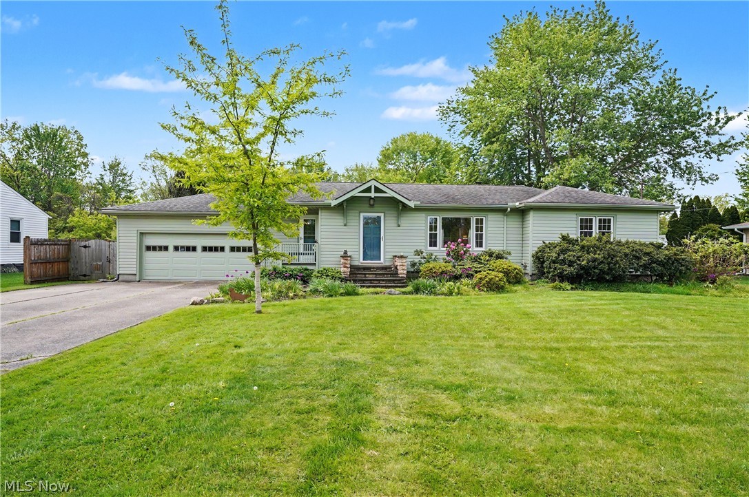 Welcome to this lovely ranch nestled on a quiet street in the heart of Amherst, a community known for its charming downtown, parks, local events, and convenient access to shopping, dining, and major highways. Offering comfortable one floor living and a thoughtfully designed layout, this home blends timeless character with modern updates. The home has been painted both interior and exterior. 
A spacious living room welcomes you with beautiful hardwood floors and a large picture window that fills the space with natural light while offering peaceful views of the wooded setting across the street. The updated kitchen features granite countertops, KraftMaid cabinetry, stainless steel appliances, and a center island with abundant storage, making it both functional and inviting.
Arched openings lead to the cozy family room, complete with a gas fireplace, custom built ins, and sliding doors that connect seamlessly to the outdoor living spaces. Enjoy relaxing or entertaining on the private deck, or enjoy the screened porch overlooking the backyard. Sellers have added a doorway from the porch to the family room for easier access to the interior of the home. 
The main level offers three bedrooms, along with an updated full bath and convenient half bath. A partially finished lower level provides exceptional flexibility with space for a recreation room, home office, fitness area, or additional gathering space.
Outside, the private backyard offers plenty of room to enjoy the outdoors and includes a storage shed and chicken coop that may remain with the property. Meticulously maintained throughout the years, this move in ready home offers the perfect combination of comfort, character, and convenience. Ideally located near schools, parks, downtown Amherst, and everyday amenities.