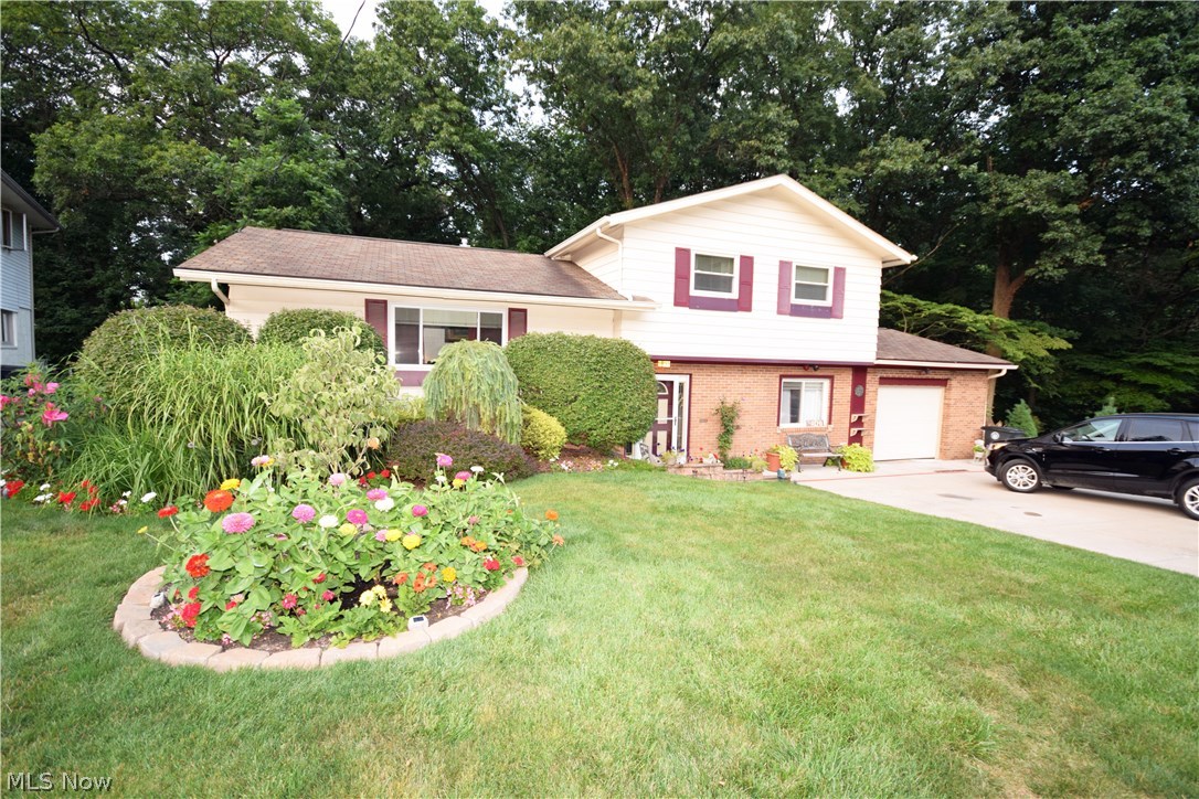 Come see this beautiful 3 bedroom, 2 bath spacious split level with many updates! This house is inviting inside and out!  Serene park like yard which backs into Sand Run Metro Park!  Amazing landscaping! Vaulted ceilings, new doors throughout including a beautiful front door with a unique glass design. Remodeled bathroom with a large shower tub! Enjoy the outside view while relaxing or entertaining friends on the enclosed patio. Set an appointment to see this home now!