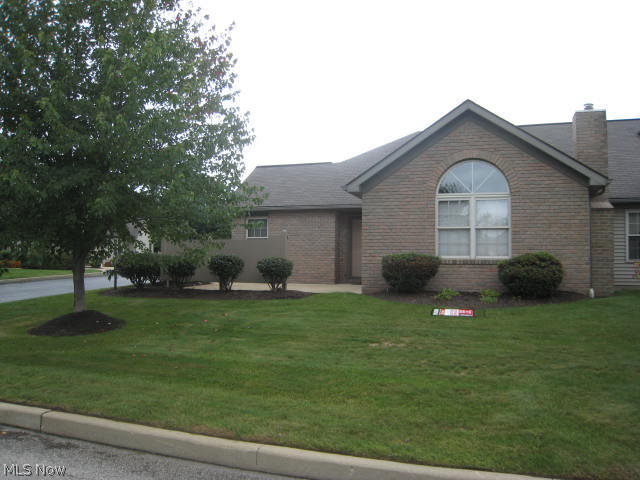 Decorator perfect!  Just place your furniture and move right in.  Tastefully remodeled and improved 2 BR 2 bath condo overlooking the golf course.  The cathedral ceiling great room has arched window and gas fireplace.  Dining area and breakfast bar opens to the kitchen with beautiful corian solid surface counter tops, glass backsplash and stainless appliances make entertaining easy. Spacious master bedroom, with walk-in closet and full bath, readily accomodates king size furniture.  The second bedroom features a wall of closets.  The main bath has a step in shower .Convenient first floor laundry and attached 2 car garage /opener and water has a wall of cabinets and pull down stairs for storage.  Private patio. too.  Quick possession.
