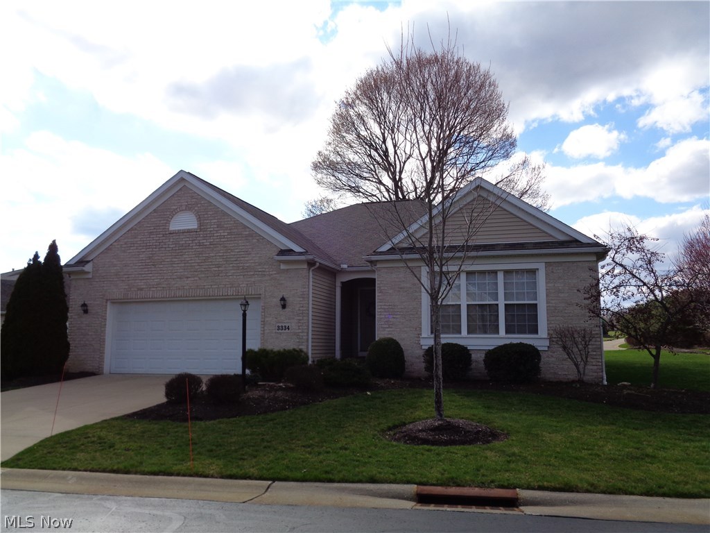 Wonderful free standing cluster home. Large open foyer, Dining room, wood flooring, crown molding and French doors opens into the foyer.  Sky light in the kitchen, breakfast bar, double oven, island, cook top. Master bedroom with double closets, full bath double sinks, whirlpool tub and walk in shower. Large patio of the kitchen eating area. First floor laundry with cabinets, washer, dryer, laundry sink.   Family room, bedroom and full bath in the lower level adds 1000 sq ft to home.  America's Preferred Home Warranty included.