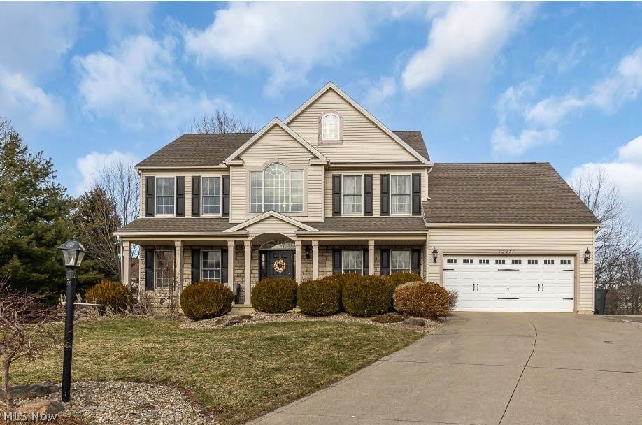 Gorgeous colonial in Westwood Farms on almost 1/2 acre private cul-de-sac lot * Updated throughout * Accent and feature walls gives this home a complete modern touch * Off foyer is stunning dining room with tray ceiling and pillars * Kitchen with granite countertops, white cabinetry, breakfast bar, pantry and dining area that is open to the great room with crown molding and fireplace feature wall * Flex room with crown molding could be media room, den, office or sitting room * 1st floor laundry * 2nd floor has oversized primary suite with stone look electric fireplace wall, sitting room/office area, walk in closet, barn doors to the  large primary bath with dual sinks, shower and soaking tub * 2nd floor also includes 3 additional bedrooms and main bath with granite countertop * Lower level has family/rec room with electric fireplace feature wall, dry bar, bonus room for workout/office/bedroom and gorgeous full bath with walk in shower * Lots of storage in basement as well * Enjoy the stamped concrete patio with a pond view * 2+ car garage with bump out storage area * Many new light fixtures * 2nd floor has all new doors * Fresh paint throughout * New fixtures * Newer carpet * Refrigerator, microwave and dishwasher new 2025 * Rainbird sprinkler system * Security system * Amazing association pool, tennis courts, basketball, playground and clubhouse to enjoy! Must see this home today!