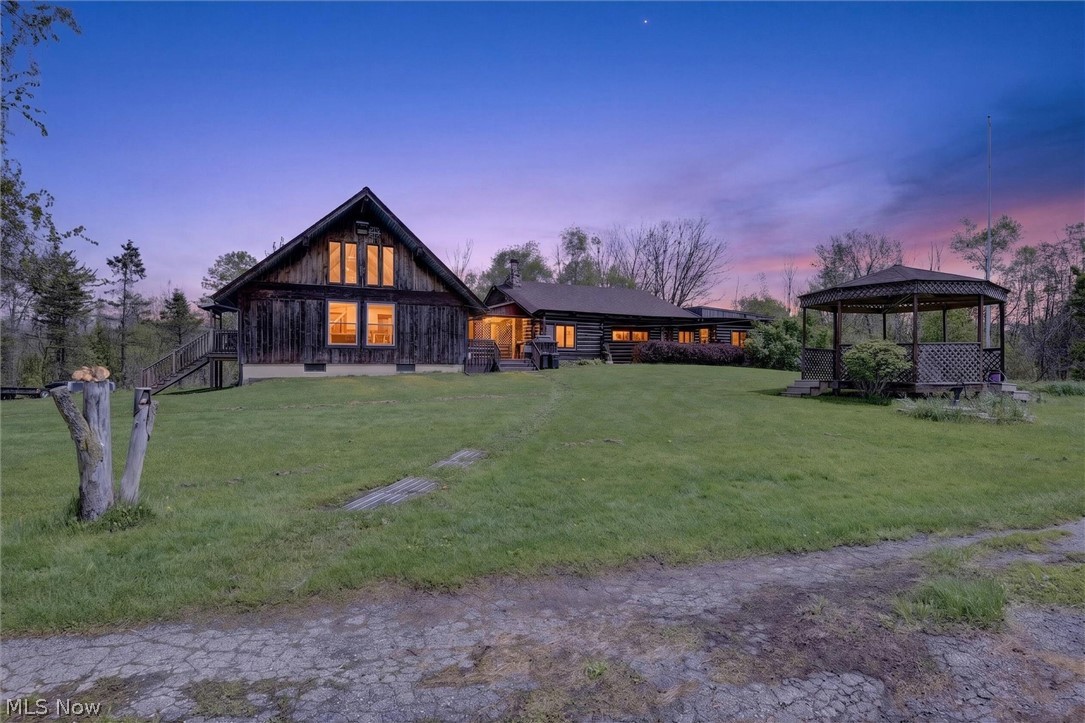 60-acre private retreat in Ashtabula featuring a character-filled A-frame main home, separate log cabin, and a setting designed for privacy, recreation, and peaceful country living. Tucked away on a scenic parcel, the main residence offers soaring vaulted ceilings, exposed wood beams, oversized windows, and an open living/kitchen layout that captures the charm of a true cabin-style home. The loft overlooks the main living area and provides flexible space for guests, an office, additional storage, or a cozy retreat.

Beyond the main home (built in 1995), the property includes a separate finnish log cabin (built in 1954), creating added versatility for guests, hobbies, recreation, or future use. The expansive 60 acres offer room for trails, hunting, outdoor activities, homesteading, equipment, or simply enjoying the privacy and natural beauty of the land. A full lower-level/workshop area adds valuable storage and utility space.

Opportunities like this are hard to find — acreage, privacy, multiple structures, and a unique A-frame home all in one package. Whether you are searching for a weekend escape, recreational property, or full-time country retreat, this property offers incredible potential.