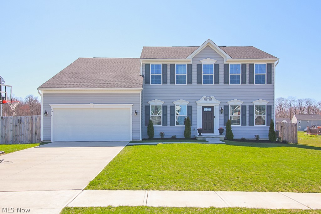 Almost new expanded Ryan Colonial w/ over 3,000 finished sq ft of living space! This home boasts a gorgeous vinyl exterior presence w/ traditional shutters, fabulous and large privacy fenced rear yard w/ elevated 22 X 16 treated deck including all the goodies like; 10 x 10 shaded pergola, jungle gym swing set, huge trampoline, 10 x 10 double door shed, multiple raised gardens and 20 X 10.5 fenced and gated RV/Boat pad. The pics and virtual 360 tour make your viewing of this awesome home quite simple! The owners spared no expense in design and extra features like; 7 X 3.5 Hand-made hickory butcher block island, beamed ceilings in family room, slider natural wood dining room barn door, Freesia carpeting thru-out, plumbing for full bath already in for basement, 2nd floor laundry room. A true decorator's delight!