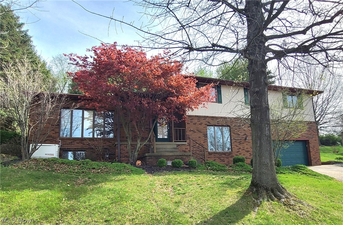 Welcome to this spacious and beautifully maintained 2,700+ square foot home located in a highly desirable St. Clairsville neighborhood! This impressive 4-bedroom, 2 ½-bath residence offers the perfect blend of comfort, functionality, and quality throughout. The remodeled kitchen is a true highlight, featuring a tile floor, stunning cabinetry, Corian countertops, and all appliances included—ideal for both everyday living and entertaining. Just off the main living space, the inviting rear sunroom provides a relaxing retreat year-round, complete with a gas heater for added comfort and an outdoor hot tub just a step away. This well-cared-for home also includes a Generac whole house generator, giving you peace of mind in any season. With generous living space and thoughtful updates, this property is ready to welcome you home!