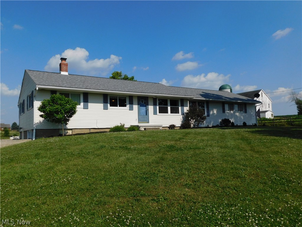 You can experience beautiful sunrise and sunsets from this 1500 Sq. Ft. Ranch located in Northwestern School District on 3 acres. 3 bedrooms 1 bath ( these is a toliet in the basement in the storage room and plenty of space to complete a 2nd full bath) open floor plan with 2 bedrooms on one side of the home and master bedroom on the other. Hardwood floors located throughout most of the home. The finished lower level family room and dining area has the availability for water ready to install your own bar or mini kitchen and walks out onto a stamped patio and brick fire pit.   The views of the countryside are amazing from the above ground pool and nice size deck with plenty of room for entertaining. Some new windows, new roof, pool installed along with new deck, stamped patio and new walkout lower level door and finished family room are a few of the updates to the home. The is a must see home.