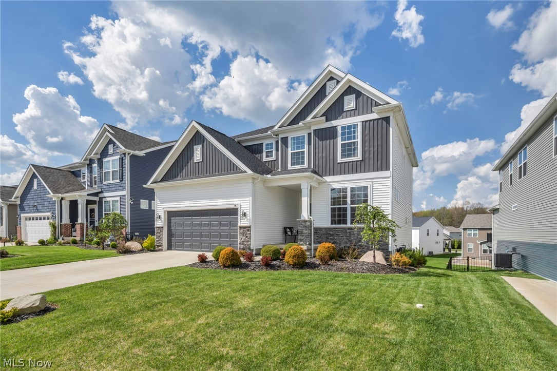 Nestled in one of the most sought-after communities within the Highland School District, Blooming Acres offers a perfect blend of comfort, style, and everyday functionality. This thoughtfully designed home welcomes you with a bright, open foyer that flows seamlessly into an airy, open-concept layout-ideal for both daily living and entertaining. At the heart of the home, the kitchen impresses with a large granite island, walk-in pantry, dedicated workstation, and an adjoining dining area with direct access to the back deck-creating an effortless indoor-outdoor lifestyle. Just off the kitchen, a practical mudroom entry from the garage features a built-in boot bench and ample storage to keep everything organized. The main level also includes a spacious family room anchored by a striking floor-to-ceiling stone fireplace, a private front-facing office, and a generously sized half bath. Upstairs, a versatile loft provides additional living space perfect for relaxing or gathering. The conveniently located second-floor laundry adds everyday ease, while the primary suite serves as a true retreat-complete with dual vanities, custom luxury walk-in shower tiled from floor to ceiling, and an expansive walk-in closet with built in organizers. Two additional bedrooms and a full bath complete the upper level. The finished lower level expands your living options with a large recreation area featuring a dry bar, a separate flex room ideal for a guest suite, home gym, or hobby space, plus a dedicated workshop and plenty of storage. Step outside to enjoy the wood deck overlooking a beautifully landscaped yard, enhanced with stone and mulch accents. Large windows throughout the home fill every space with natural light, highlighting the home's spacious rooms and generous closets. Residents of Blooming Acres enjoy access to community green spaces, scenic ponds, a playground, pavilion, and basketball courts-along with a vibrant calendar of neighborhood events throughout the year.
