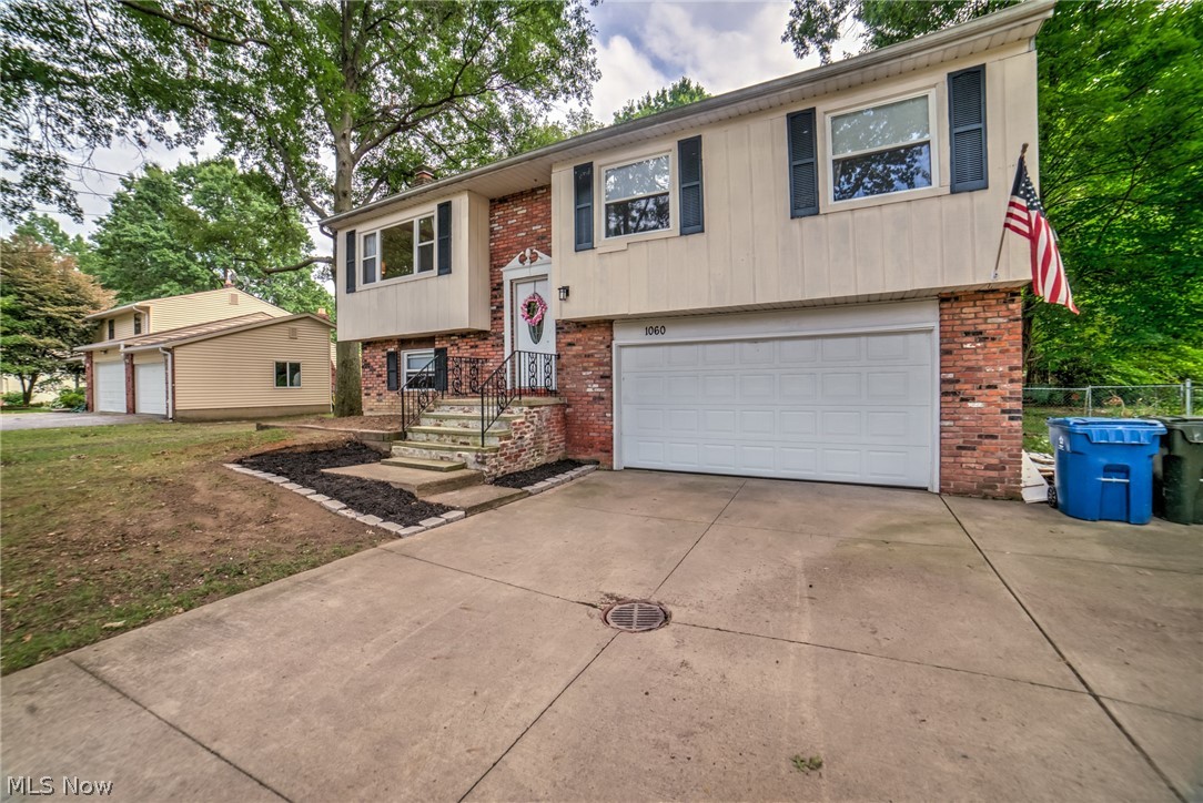 Gorgeous HGTV Gem awaits !  Meticulously maintained Bi-level has been renovated from top to bottom! First level offers an open spacious floor plan with large living room adjacent the dining area which leads to deck overlooking the near acre wooded lot. Pristine kitchen with granite counters and SS appliances. Three large bedrooms and beautiful ceramic bath complete the 1st level. The lower level has a custom fireplace and family room along with a theater area to cozy up and watch those favorite shows and movies in the cold winter months. Additional 1/2 bath, laundry/utility area complete the lower level. Attached 2 car garage. Fenced yard. All appliances included..even furniture can be negotiated. Excellent Rated Nordonia Schools. Convenient location to metroparks, Cuy Valley Natl Park, Brandywine & Boston Mills ski resorts. Easy access to I-271 and I-480.