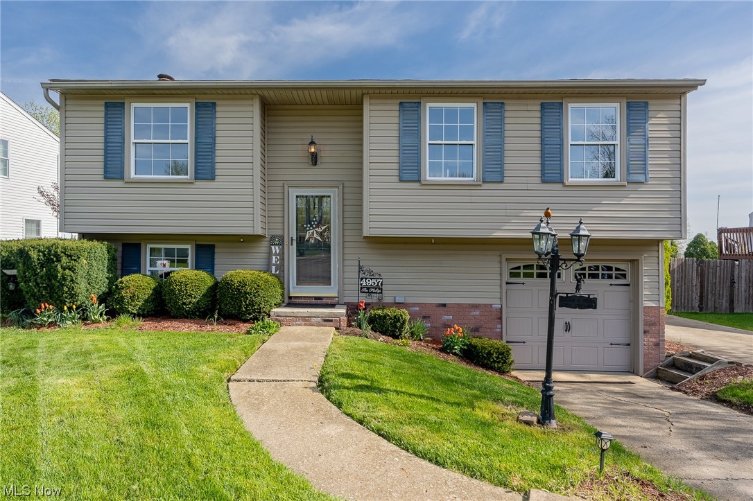 Welcome to this extremely loved original one owner home for over 50 years! Don't let this home be deceiving, it is much more than meets the eye! Walk into the bright, freshly painted great room that meets all of your entertaining needs and see the new carpet that was installed throughout the entire home to make it move-in ready! Off of the great room is the quaint eat-in kitchen with wood cabinets which gives you a cozy, cottage feel for all of your hosting needs. A sliding patio door will take you outside to the second-story wood deck (12x10) where you can enjoy your morning coffee with a serene view of the very spacious fenced-in backyard. The first level has 2 bedrooms, one being the master bedroom (17x12) with double closets. On the lower level, you will find a finished recreation room with a fireplace which is a great flex space to use for a possible 3rd bedroom, office, playroom, or whatever you desire! Stepping out onto the covered patio, you can enjoy this cute wooden porch swi
