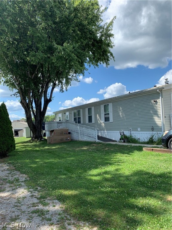 Check out this freshy painted and updated manufactured home located on a rental lot. Features a very spacious 3 bedroom and 2 full bath home. Master bath has a newly installed walk-in bathtub. Refrigerator, stove/convection oven both new. New metal roof installed 2021, new hot water heater, new flooring in living room, dining room, and kitchen, new toilets, new faucets, and some updated light fixtures. New deck with ramp. Great location near many amenities in Maysville school district. Lot rent is $290 a month, which includes, water, sewer, and trash. Potential buyer must fill out an application and be approved by the park.
