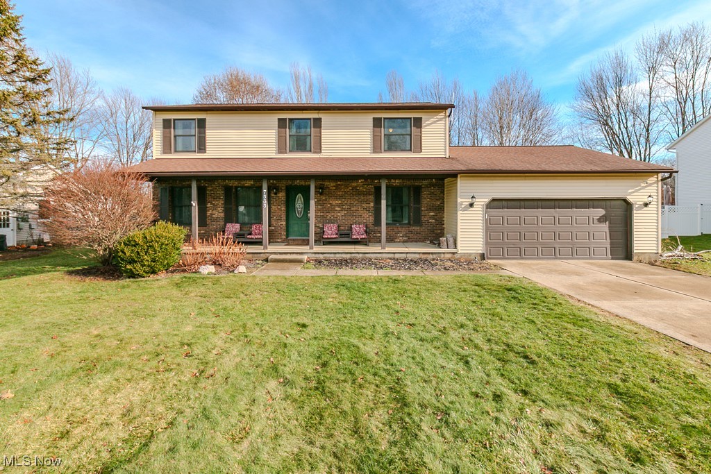 Welcome to this spacious South Mentor colonial designed for real life — where room to spread out, gather together, & grow into the future truly matters. Set on a generous .52-acre lot with a shadowbox privacy fence & direct gated access to Hopkins green space & Kreuger Park walking trail, this home offers a rare combo of indoor flexibility & outdoor freedom.

An oversized front porch sets the tone as you step inside to find a layout ideal for busy households, remote work, & entertaining. The expansive great room is filled with natural light from large windows & anchored by a wood-burning fireplace, offering plenty of room to create multiple living zones.

The eat-in kitchen features granite countertops, updated flooring, a butcher block island & newer appliances (dishwasher, refrigerator, oven/range, & hood – all 2022) — perfect for everyday meals or hosting family & friends. Just off the kitchen the vaulted Florida room provides a bright, relaxing space for reading, playtime, or casual gatherings from spring through fall.

Upstairs you’ll find 4 bedrooms & 2 full baths, including new carpeting throughout the second floor (21). The finished lower level offers flexible bonus space for a rec room, home office, workout area, or guest space, complete with a custom-made wet bar added in '22 — adapting easily to your changing needs.

Recent improvements include entire interior walls & ceilings freshly painted (24), wainscoting in the dining room & foyer (24), newer double-paned windows, oak trim & moldings, updated flooring throughout much of the home, & a newer patio door. Major mechanical updates provide peace of mind, including a new A/C unit (22), furnace (20), hot water tank (17), & hot water circulator (23), plus a power garage door opener (22).

The home’s size, layout, & location provide an exceptional opportunity to build long-term value in a sought-after Mentor neighborhood. This is a home built for everyday living — with room to make it your own.
