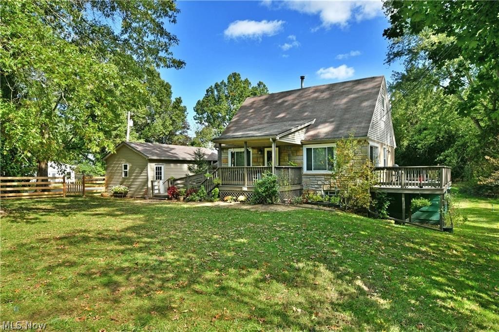 Charming Cape Cod nestled on nearly an acre in Canfield Township! Enjoy a peaceful, tree-lined setting with the convenience of nearby shopping and restaurants, plus easy access to many metropolitan parks and the county fairgrounds.

The home is easily accessible from the driveway, with a 1½-car garage and a welcoming covered front porch. The true highlight of this property is its location — the street dead-ends into a nature preserve and bird sanctuary, offering privacy and incredible natural beauty right outside your door.

Step inside to find beautiful hardwood floors throughout, all-new windows, and updated lighting that brightens every room. The kitchen is warm and inviting, featuring LVT flooring, recessed lighting, and plenty of cabinet space for all your cooking essentials.

The spacious living and dining rooms provide an ideal layout for relaxing or entertaining. From the dining area, step out to the large deck overlooking a peaceful, wooded view — the perfect spot to unwind and enjoy nature.

Both bedrooms offer nice-sized closets and the full bath includes a newer walk-in tub/shower combo. Electrical and plumbing updates add peace of mind for the next owner. 
This 2-bedroom home is full of character and thoughtful updates. Don’t wait — schedule your private showing today!