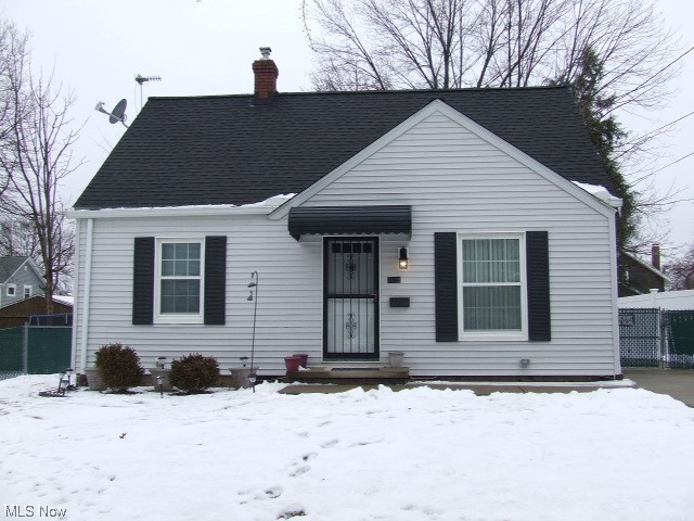 Wonderfully updated 3-bedroom Cape Cod with 2 bedrooms and full bathroom on 1st floor.  Living room and all 3 bedrooms have new carpet, new paint and ceiling fans.  Eat-in kitchen has farm sink, new cupboards and countertops, ceramic tile floor, and stainless steel dishwasher and gas stove.  Updated bathroom with deep tub, newer surround, new medicine cabinet, built-in towel cubby, and ceramic tile floor.  Top of stairs has shelf for those personal extras and bonus space that is perfect for dressing room, office, nursery or whatever you want it to be.  Third bedroom upstairs has new carpet, new paint, new lighting with it's own baseboard heating, plug for window air conditioning, and closet with built-ins.  Waterproofed Basement has area that could be used for rec room area or storage, laundry area with both electric and gas dryer hook-ups, utility sink, sump pump, glass block.  Detached garage with carport that could cover a car or be a covered patio, with hot tub plug.  Backyard is completely fenced in with privacy fence and chain link locked gate.  Gate is currently at middle of driveway so pets could be let out the side door. Seller could move gate closer to garage so car could pull in further in the driveway.   There is oak floors on first floor under the carpet in fair shape.  Lawn mower and snow blower in garage will stay.  This HOME is just waiting for you to move in!!