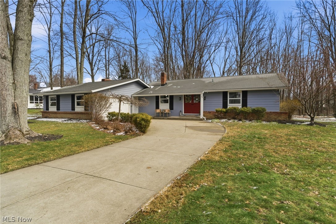Experience the perfect blend of modern updates and serene privacy in this stunning South Mentor ranch. Situated in the sought-after Beaver Creek neighborhood, this home sits on a sprawling 3/4-acre wooded lot and boasts over $40,000 in recent high-end improvements. From the moment you step through the elegant slate foyer, you are greeted by a bright, open floor plan featuring fresh designer lighting throughout. The heart of the home is the vaulted great room with its beamed ceiling and cozy wood-burning fireplace, which flows seamlessly into a chef's kitchen complete with granite countertops, a breakfast bar, and a full suite of appliances. The kitchen overlooks a massive dining room showcased by an impressively sized picture window to take in all the sights in your wooded backyard.
The bedrooms offer a peaceful retreat, including a spacious primary suite with a walk-in closet and a private full bath. Both bathrooms have been beautifully remodeled with sleek quartz countertops, ceramic flooring, and modern 36" comfort-height vanities. The newly finished lower level is a true game-changer… the addition of a formal egress window makes this versatile space ideal for a premium home office, playroom, music room, or an optional fourth bedroom.
Rest easy knowing all the "heavy lifting" has been completed with high-ticket mechanical updates, including a new electrical panel and a new hot water tank, both installed in 2023 when the basement was finished. Additional perks include a new chimney liner (2023), an attached 2.5-car garage, and direct access to a private rear patio overlooking the wooded grounds. Offering a rare combination of move-in-ready style and peace of mind, this South Mentor gem is ready for its next owner. 
Contact this listing agent or your second-favorite REALTOR for a showing TODAY!