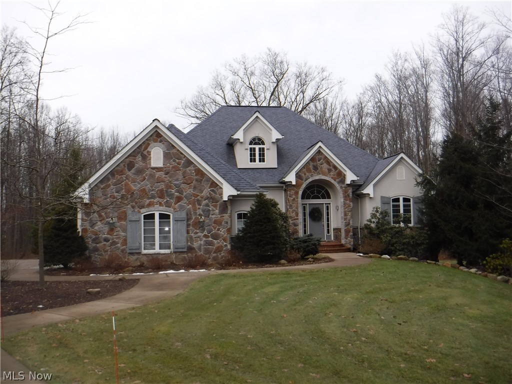 An absolutely stunning Ranch in Hinckley! Wide open floorplan with soaring ceilings. Cherry cabinets w/ white/black granite counters anchor the gourmet kitchen.Comfy great room w/tone fireplace has amazing views of the wooded backyard. Jack-n-Jill BA separates 2 large BRs. The spacious master retreat has a fireplace and new walk-in shower plus new hard surface vanities! Two ample sized walk in closets are located in the hall leading to the bathroom. A generously sized laundry room can be found steps away from the kitchen. Formal dining room with hardwood floors welcomes guests to the home. A cozy covered deck is accessed off the breakfast room( perfect for Winter grilling) The lower level is out of this world! a granite/stone bar, hearth room, enormous rec room, and the multiple windows make it hard to believe that you are on a lower level! A craft room w/ sink and a wine making room are added features. A spare BR and full bathroom are steps away from the great room. Large storage area