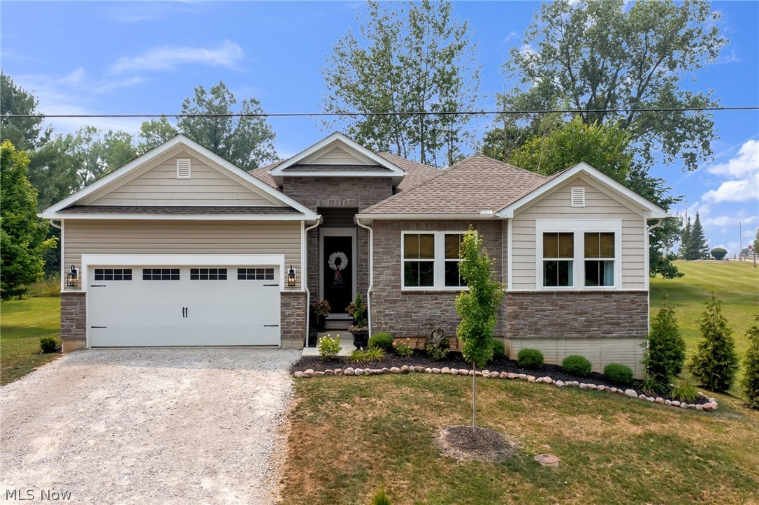 Welcome to this exceptional first tier ranch home in the sought after Candlewood Lake community, where effortless one level living meets quality craftsmanship and modern design. Brand new in 2025 and impeccably maintained, this 4 bedroom, 2 bathroom home offers a light filled, open floor plan with all bedrooms and the laundry room conveniently located on the main level.
The heart of the home is the stunning kitchen, featuring an oversized quartz island, abundant cabinetry, stainless steel appliances, walk in pantry, and a spacious dining area that flows seamlessly into the great room. Vaulted ceilings with exposed wood beams and expansive windows create a warm, inviting space that's perfect for both entertaining and everyday living.
Privately situated in its own wing, the owner's suite offers a peaceful retreat with a tray ceiling, walk in closet, and a spa inspired bathroom featuring double vanities, patterned tile flooring, a freestanding soaking tub, and a tiled walk in shower with a rainfall shower head. Three additional bedrooms, a full bathroom, and a dedicated office with sliding doors complete the main level. Downstairs, the full basement with poured concrete walls provides abundant storage and excellent potential for additional living space.
Enjoy your morning coffee on the covered back porch overlooking greenspace or enjoy Candlewood Lake's private beach, clubhouse, pool, tennis and pickleball courts, playgrounds, boat launch, and more. Vacation living awaits year round. Incredible location close to Gate D and easy commute to Columbus.