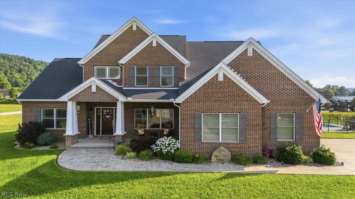 Built in 2019 and impeccably maintained, this stunning home offers the perfect blend of timeless elegance, everyday comfort, and room to grow. This exceptional property is ready for its next chapter. From the moment you arrive, you’ll appreciate the beautifully landscaped lot, incredible curb appeal and additional detached garage that provides the perfect space for hobbies, storage or extra vehicles. Step inside to discover an impressive open floor plan filled with natural light, soaring ceilings, and a breathtaking floor-to-ceiling stone fireplace that anchors the spacious great room. You'll love the gorgeous kitchen featuring granite countertops, abundant cabinetry, a large center island with seating, and seamless flow into the dining and living areas—perfect for entertaining or simply enjoying time together. The spacious first floor primary suite offers a peaceful retreat with a spa-like bath, while the additional bedrooms and generous upstairs loft area provide plenty of room for family, guests, work or play. Step outside and enjoy your covered porch overlooking a beautiful in-ground heated pool, creating the perfect place to relax on summer evenings or host unforgettable gatherings. Need even more space? The full unfinished basement offers endless possibilities—whether you envision a home theater, gym, rec room, additional bedrooms, or simply incredible storage, it’s a blank canvas waiting for your personal touch. This is more than a house—it’s a place where holidays are celebrated, memories are made, and everyday life feels just a little more special. Schedule your private showing today and experience everything this remarkable home has to offer.
