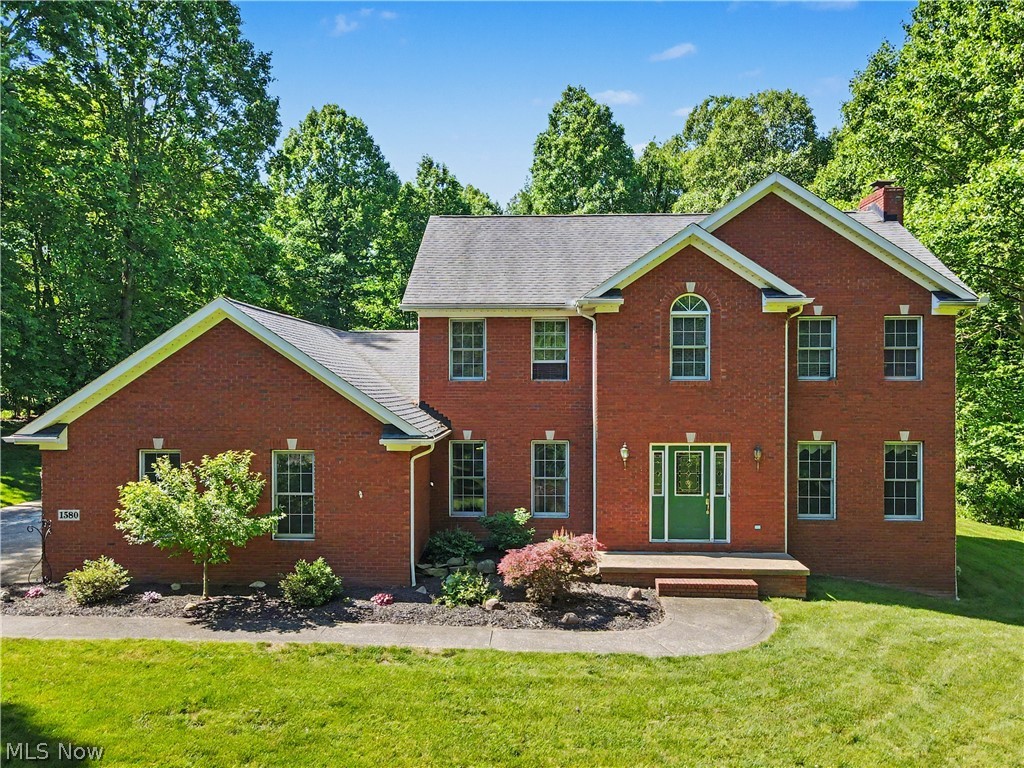 Welcome Home to this beautiful brick front Colonial situated on over 4 acres in the peaceful town of Clinton, Ohio. The exterior design is impressive and coupled with a side entry garage along with the neatly manicured lawn and flower beds all together result in an outstanding curb appeal. From the foyer entry to your left is the formal dining room and to your right  you'll find the spacious great room with a woodburning fireplace. The eat in kitchen is bright and filled with natural light from the large bay window at the sink and the sliders at the eating area. The first floor also includes an office with furniture included, a 1/2 bath and first floor laundry. Stepping out back from the eating area you'll find the oversized 16 x 25 Timber Tech deck porch that overlooks the flat and open backyard with plenty of room to roam. There's also 12 x 16 shed for extra storage. The second floor has 4 bedrooms and 2 full baths. The master bedroom has a cathedral ceiling and private bath with a jetted tub, separate shower and double sinks. All of the  bathrooms and most of the first floor have newer vinyl plank flooring and all carpeting is newer too.  The basement is spacious and wide open for storage or play. This home has been well maintained , the HVAC was replaced in 2020 and security system is included.