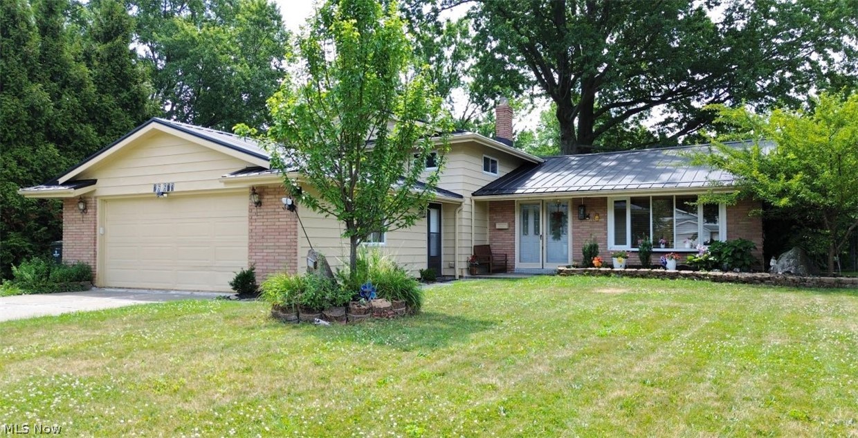 -Why Build New When You Can Have Better-
Completely updated inside and out, this stunning 4-bedroom, 2.5-bath split-level in the highly sought-after Sandy Ridge community is the one you’ve been waiting for! Featuring a brand-new lifetime metal roof (2026) on both the home and shed, a new furnace (2024), new hot water tank (2025), and newer windows, this home offers the peace of mind that comes with today’s most important upgrades. Step inside and fall in love with the beautifully updated interior, where an open-concept floor plan, fresh neutral colors, recessed lighting, stylish finishes, gorgeous tile flooring, and original hardwood floors upstairs create a warm and inviting atmosphere. The spacious eat-in kitchen offers abundant cabinetry, modern updates, and the perfect space for everyday living and entertaining. The inviting lower-level family room features a cozy fireplace, convenient half bath, laundry area, and a versatile bonus room ideal for a home office, fitness room, playroom, or guest space. The private owner’s suite includes an updated en-suite bath and a custom built-in wall safe.Step outside to enjoy the beautifully landscaped yard, attached two-car garage, and an extra-wide driveway with parking for up to eight vehicles. Best of all, you’re just a short walk to the Sandy Ridge community pool, park, and playground, making it easy to enjoy summer fun and neighborhood amenities. You’ll also love the convenient location—just 5 minutes from Great Northern Mall, shopping, dining, and entertainment, with quick access to I-480 for an easy commute. With the major mechanical updates already completed—including a lifetime metal roof, new furnace, new hot water tank, and a beautifully updated interior—this truly move-in-ready home offers the perfect combination of style, comfort, convenience, and long-term value. Homes with this level of quality and upgrades are rare—schedule your private showing today before this exceptional opportunity is gone!