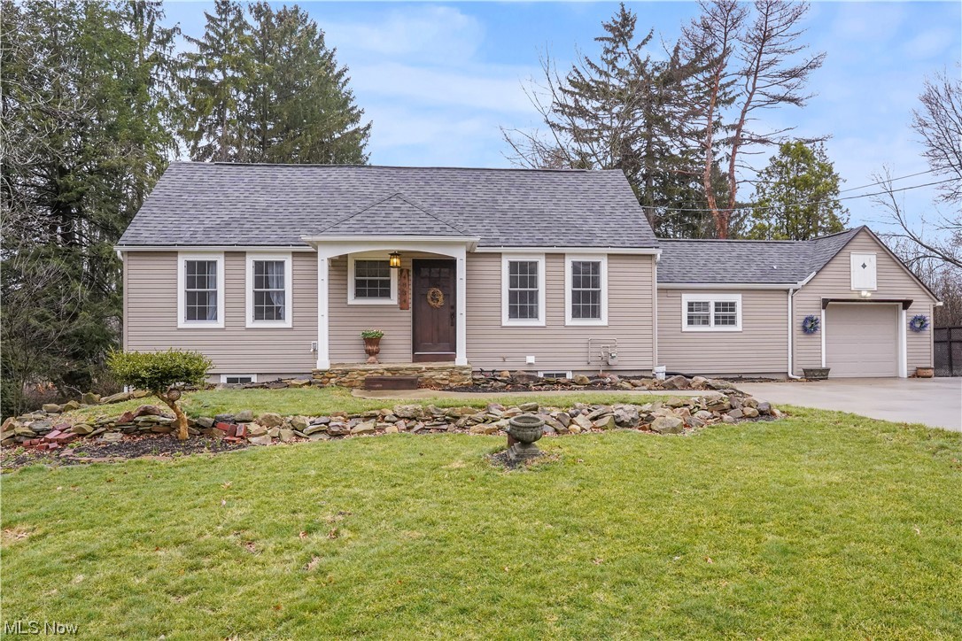 Keeping the charm and character, this home received a total custom, high-end redesign in 2017 and is one of a kind.  The detail is amazing throughout including bold, beautiful stained woodwork with wide baseboards and trim on every doorway throughout the home.  Enter into the spacious living room and notice the large windows, which allow for an abundance of natural light.  The eat in kitchen offers maple soft close cabinets, plenty of counter space and includes the SS appliances.  The owners suite features a 
7' x 6' walk in closet and nice full bathroom with tiled walk in shower including a bench seat & rain head/hand wand.  Another bedroom and arched doorway office complete the first floor.  As you walk down the quarter turn staircase to the lower level, find a bedroom with large windows,  full bath, rec room with a convenient exterior entrance leading to the patio. The concrete driveway has a parking/turn around that is 3 cars wide and even the Goalrilla in-ground basketball hoop conveys.  During Spring, Summer and Fall step out the back door and sit on your large, curved, concrete patio incorporated with a firepit and enjoy the serene, countrylike setting.   Grill out on your natural gas Weber grill, and In the summer, the outdoor shower on the patio will be a nice convenience.  The attached heated garage is extra deep.  Minutes away from Rt. 8, the Cuyahoga Valley Towpath Trail, Hudson's specialty shops, restaurants and grocery stores is an ideal location.  Every inch of this home was updated in 2017 including the roof, Pella windows, new well head and pump, furnace, and AC.  Hot water tank -2023.   Waterproofing was completed in 2019 by Pioneer Basement Solutions with a lifetime warranty.   This home is truly amazing.