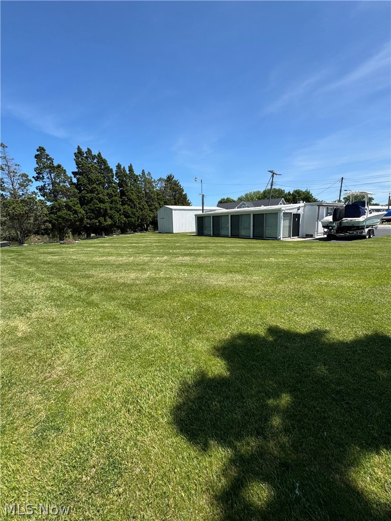 WATERFRONT Property with 85 Ft. private dock in the highly sought after waterfront community of Nugent's Canal. This beautiful, impeccably maintained property is truly a rare find that spans over four parcels located at the end of the street and close to the canal entrance from the Portage River. The parcels include a fully furnished (less personal items), one-bedroom mobile home (that can be converted back to a two bedroom), one-bath that has been updated and is move-in ready. Updates include but not limited to: new windows, new bathroom, new kitchen countertops, sink, floor and refurbished cabinets. Entering from the driveway through the fully enclosed glass-door waterfront sunroom, you are greeted with an expansive living space that can be opened to welcome fresh breezes while enjoying the scenery of boats passing by. A couple more steps into this versatile home, you are greeted with an open kitchen and living space with easy access to the bathroom and bedroom. For all the toys, there is a 14.5 x 31 ft. private garage, and a full vacant lot creating a wonderful yard space. With approximately 85 ft. of dockage out the back door and 225 ft. of surrounding canal water frontage, a relaxing entertaining environment awaits.

Boating enthusiasts will enjoy direct Lake Erie access via canal to the Portage River leading through the historic downtown Port Clinton harbor, making this property an ideal recreational home-base for boating, fishing, and water sports.

Nugent's Canal is known for its lively boating and social culture with the Nugent's Canal Yacht Club and Lagoon Saloon a short golf cart ride away. The property offers a furnished layout suitable for a year-round permanent residence, weekend getaways, seasonal use, or an amazing canvas for your future dream home. Whether you enjoy as-is or wish to update to fit your vision, this property has immense potential. Don't miss your chance to own a beautiful waterfront paradise, so schedule your showing today!