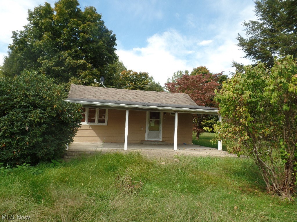 2 bedroom one bath fixer upper,  Living room has a fireplace. There is a nice yard, Concrete front porch and back patio.