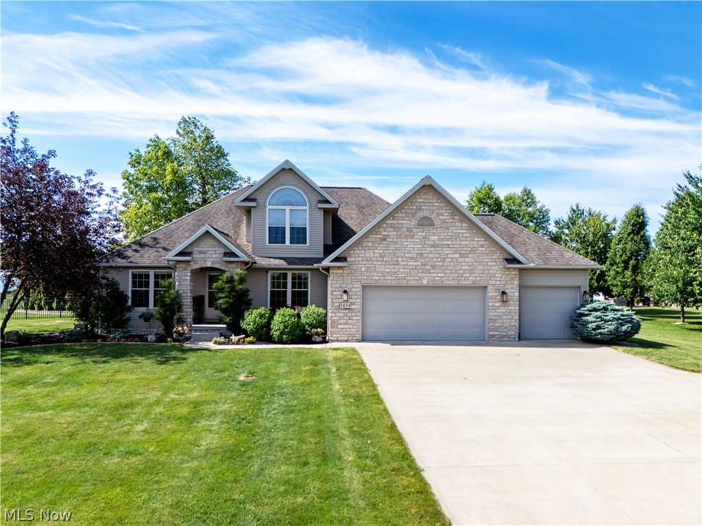 Exceptional quality and craftsmanship define this stunning Gettysburg Farms residence, offering over 3,600 square feet of beautifully appointed living space. Designed for both elegant entertaining and comfortable everyday living, this home features a luxurious first-floor primary suite highlighted by a completely remodeled spa-inspired bath by Clazak Kitchen & Bathroom. This exquisite retreat showcases a custom tiled walk-in shower with bench seating, dual vanity and high-end finishes throughout. The impressive great room features soaring vaulted ceilings, rich maple hardwood flooring and a striking stone fireplace that serves as the centerpiece of the home. The gourmet kitchen is thoughtfully designed with granite countertops, stainless steel appliances, abundant custom cabinetry and a spacious breakfast area overlooking the backyard oasis. A private home office, convenient first-floor laundry, formal dining room and 1/2 bath complete the main level. Upstairs, you'll find two generously sized guest bedrooms and a full bath, while the finished lower level expands the living space with an impressive recreation room, wet bar, family room, exercise room, flex space and additional half bath. An unfinished storage area provides exceptional organizational space. Step outside to your own private retreat featuring a large patio with awning, above-ground pool with newer Trex decking, professionally landscaped grounds, decorative curbing, fenced yard and a 16x20 outbuilding for additional storage or hobby space. The oversized 3-car attached garage is enhanced with a premium epoxy-coated floor. Recent improvements, including a new furnace and hot water heater add peace of mind to this meticulously maintained home. A rare opportunity to own a move-in ready property that seamlessly blends luxury, functionality and timeless appeal. Schedule your private showing today.