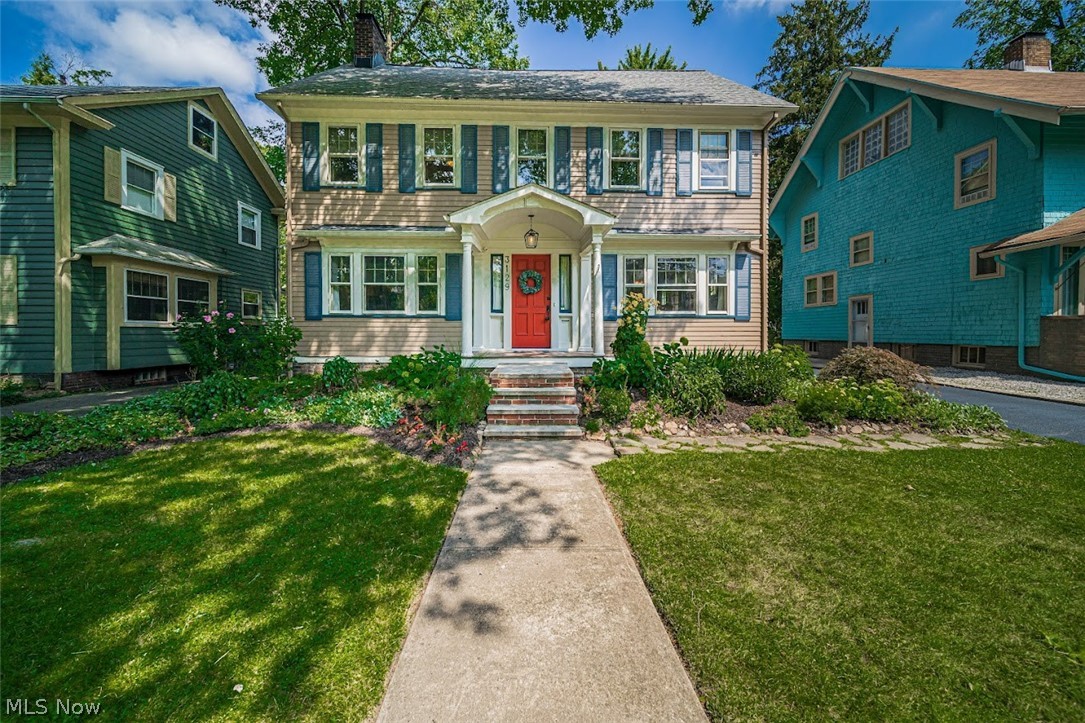 Welcome to this beautifully updated and move in ready colonial! Upon driving up, you will be greeted by a curb appeal like no other. With groomed landscaping, pleasing color scheme and a welcoming front porch, all of your guests will be in awe from the street. Enter to a spacious foyer and you will instantly notice the natural light, original hardwood flooring and trim, warm colors, and a very airy and spacious environment. Flow to the living room to enjoy the timeless brick fireplace in the winter, or the walk out back patio in the warmer weather. The dining room can host a large gathering, and sports a classic built in. The kitchen has been completely updated and modernized with all new stainless steel appliances, Kraftsmaid cabinetry, LVT, breakfast bar, custom shelving, quartz countertops and also has an egress to the back patio! The adorable half bathroom is also conveniently located off of the kitchen. The second floor boasts 4 large bedrooms, including the master with a fireplac