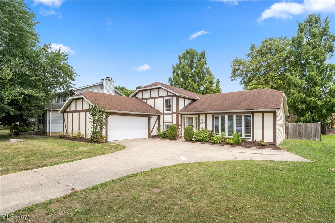 Introducing a stunning single-family home with 4 bedrooms, 2 bathrooms, and a spacious floor size of 2168 sqft. Located at 16273 Prospect Rd, Strongsville, this property offers a desirable blend of comfort and style. Step inside and be greeted by fresh paint, beautiful hardwood flooring, and large floor to ceiling windows in the living room, creating a warm and inviting atmosphere. The kitchen boasts granite countertops and barstool seating, making cooking and entertaining a breeze. On the lower level, you'll find a family room with a dramatic wood-burning fireplace and wet bar in the closet, perfect for cozy evenings spent with loved ones. The spacious master bedroom features 2 walk-in closets and separate vanity area with counter & mirror. The remaining 3 bedrooms provide ample space for relaxation and rest, while an updated full bathroom on the lower level and an additional full bathroom on the upper level adds convenience. When it's time to unwind, head to the fully fenced-in backyard with wooden deck, ideal for outdoor gatherings, gardening, or simply basking in the sun. With so much to offer, this property is truly a gem waiting to be called home. Don't miss your chance to own this incredible property in Strongsville!