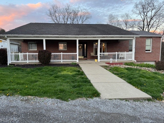 This 4 bedroom, 1 1/2 story home features a brick and vinyl siding exterior, in a prime neighborhood. A large open living and dining area featuring a gas fireplace, designed for modern entertaining with large windows overlooking acres of country living in the hills of WV. Kitchen is equipped with a large island, modern appliances and a walk-in pantry along with a Blackstone griddle. The countertop bar sits 8-10 in the breakfast nook. Spacious main level primary bedroom with large walk-in closet, spa like bathroom with double vanities, separate shower and a soaking tub. Laundry room on main floor. The nice covered concrete porch will welcome you to this home.