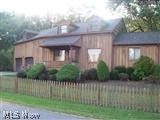 Motivated Seller , could be a short sale, seller has already begun paperwork and communication with bank. Owner is replacing electric box and having a pest treatment completed. Inspections have been done.  Home is very unique with a cabin feel, wood décor throughout. Large eat in kitchen with lots of windows viewing the backyard. Lot is half an acre.  First floor bedroom and bathroom. Walk out basement could be finished. The garage is every mans dream! Big and tall. There is an unfinished addition being used as an attic but could be a fourth bedroom. Seller has had offers but the time frames of move in dates and needed repairs did not work.