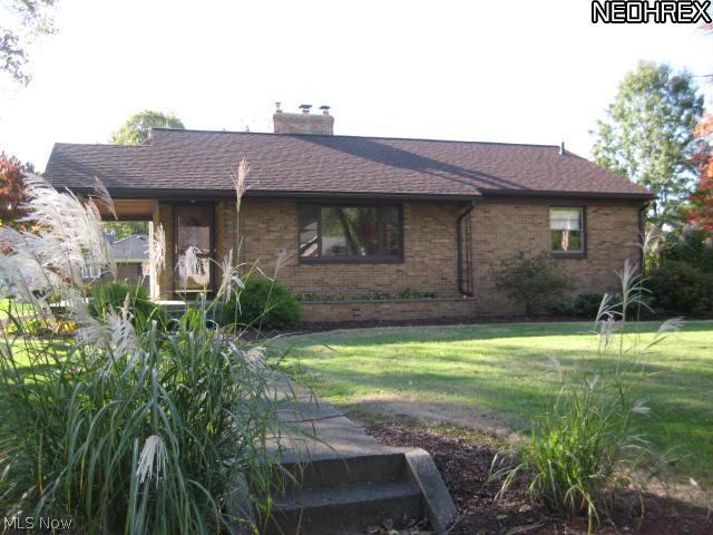 Impressive Brick Ranch built in 1953 & lovingly cared for - 2 bedrooms. large closets. One bedroom's carpet has been removed  to show beautiful hardwood flooring.Living room fireplace has gas logs. Nice sized kitchen, ample cupboards with dinette. Fresh paint in lower level. Second fireplace is wood burning, area for new bathroom, commode already in place, Lots of possibilities. Work bench will stay. Two car garage, door opener and built in storage cabinets. Asphalt drive way will be resurfaced. Large covered porch accommodates front door and side door. Great flat landscaped lot & shed. Newer roof. Extra storage in attic with pull down stairs. Quick Possession!! Come take a look.