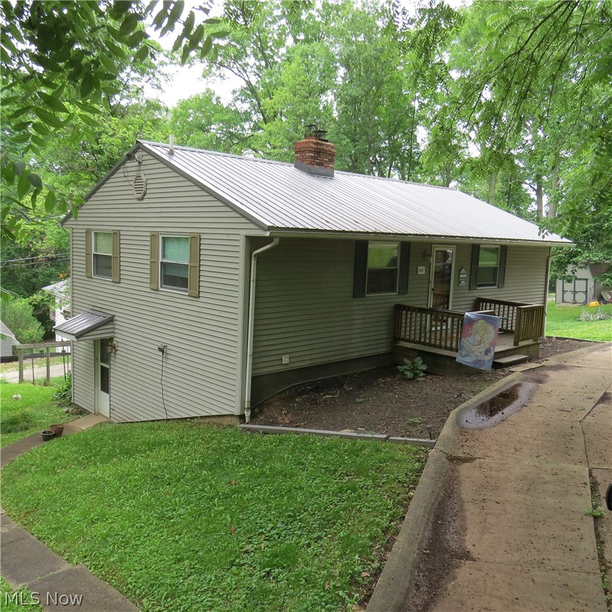 3 Bedroom, 2 Bath-Raised Ranch Home at Vo Ash Lake! Whether you're looking for a year-round home or seasonal retreat, check out his spacious 1920 sq.ft. house with fishing, kayaking, swimming, etc. on private Vo Ash Lake in southern Carroll County. The home consists of 3 large bedrooms and full bath on the upper level and open concept living space with brick fireplace and wood burning insert and full bath, on the lower level. There are 2 additional spaces that would be suitable to office space or additional bedrooms. The mud room is wonderful for boots or pet access to the fenced area for a dog. The home is easily maintained with vinyl siding, metal roofing, replacement windows, and concrete circular drive. A good 12x20 storage barn is included with the sale as are the appliances and most of the home furnishings. All this is situated on 6 lots with shade trees. Call with questions or to view this wonderful property with peaceful setting.