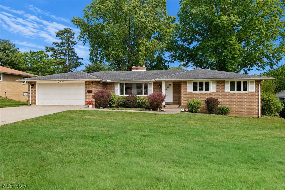 Welcome home to this beautifully maintained 3-bedroom, 3.5-bath brick ranch offering generous living space, thoughtful updates, and exceptional functionality. From the moment you step inside, you'll appreciate the inviting layout featuring a spacious living room with a cozy fireplace, a formal dining room, and an eat-in kitchen complete with stunning quartz countertops and stainless steel appliances.

The home features beautiful hardwood floors in all three bedrooms, adding warmth and timeless character. Convenience is key with a first-floor laundry room and a well-designed floor plan that offers comfortable everyday living.

The expansive  walkout lower level adds incredible versatility with approximately 1305 square feet of finished living space, including a massive family/recreation room with a second fireplace, a wet bar, a full bathroom, a bonus room perfect for a hobby or fitness area, a private office, and a mechanical room—ideal for entertaining, working from home, or accommodating guests.

Major mechanicals have been meticulously maintained, including an HVAC system installed in 2019 that has been professionally serviced twice each year for added peace of mind.

This exceptional home offers the perfect combination of space, comfort, and quality in a desirable location. Don't miss your opportunity to make this one your own—schedule your private showing today!