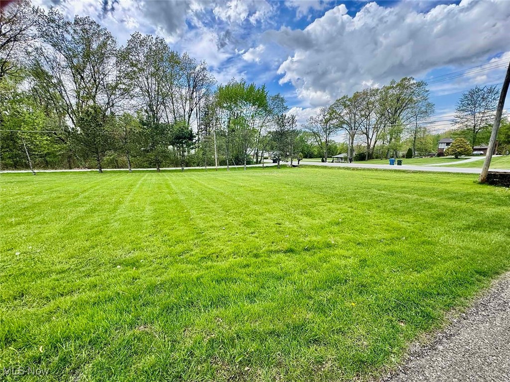 Great opportunity to own 7 acres of land, zoned B-3. Great location with heavy traffic count right on Rt 619 midway between Arlington Rd and Massillon Rd. Loads of possibilities. Call zoning for your particular needs. Water and sewer are at the street. There is a nice four-bedroom home at the front that is currently being used as a residence. Ideal conversion for an office or a business location.