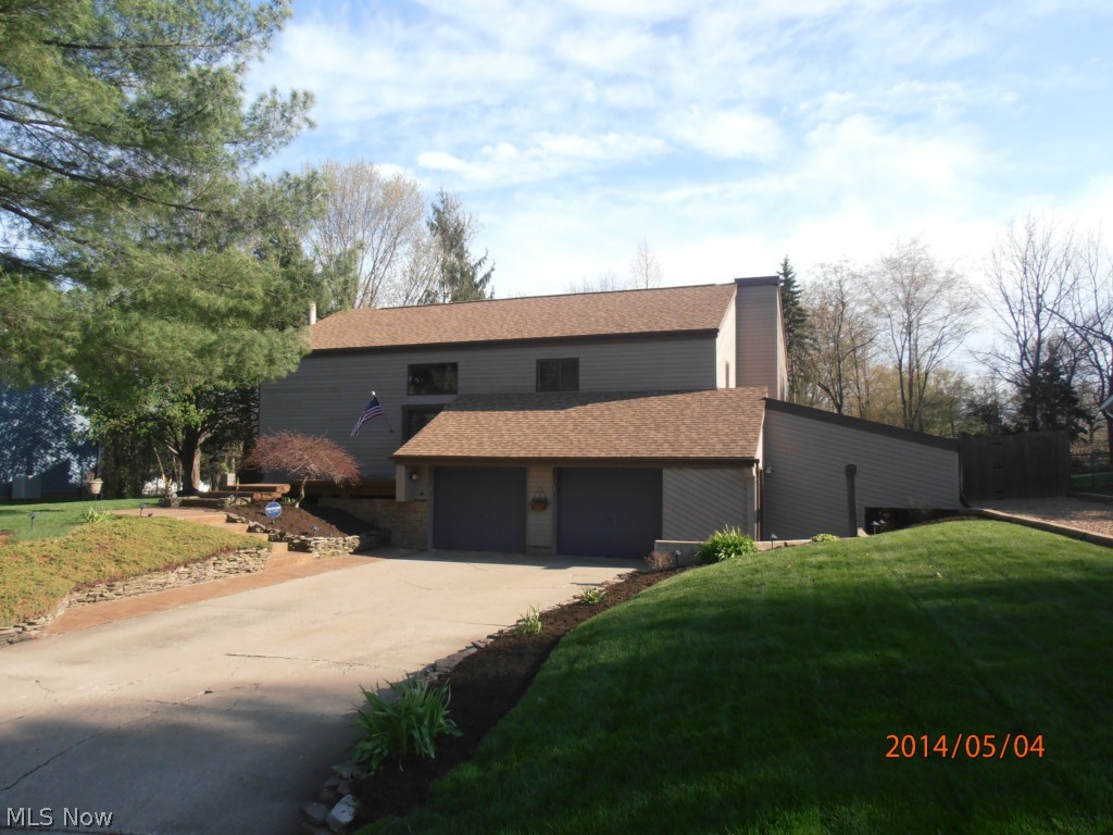 Not your typical Bi-Level. This spacious home offers an in law suite, 4 bedrooms, 2.5 baths, 2 kitchens, 2 laundry areas, attached heated garage, tank less hot water heater, vaulted ceilings, 18 x 18 stamped concrete patio, composite deck, 2 story solarium, and so much more. Updates since 2006 include: Deck, patio, 2nd kitchen, added 4th bedroom, 2nd driveway, landscaping, Lennox Furnace & Central Air, roof, carpet, bath room updates, kitchen counters & backsplash, tile floors, electric panel, garage door openers with battery back up, patio doors, solarium windows, the list goes on. Take a look today, you won't be disappointed. Seller is licensed real estate agent.