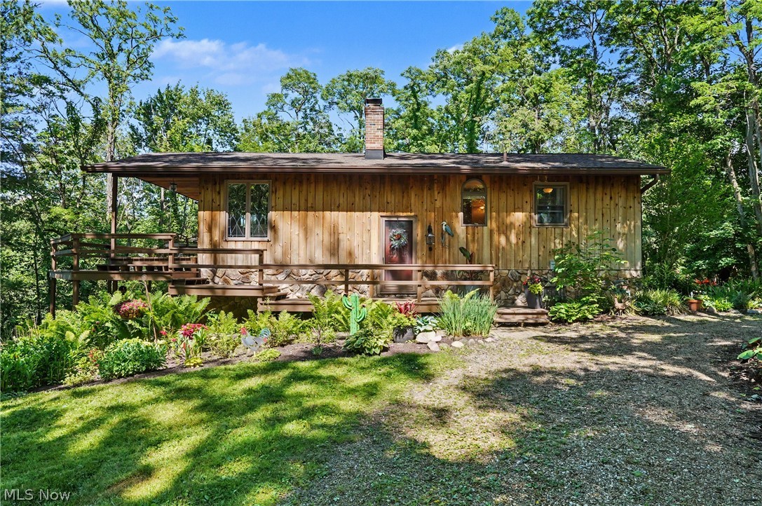 Rare opportunity in desirable Bath Township! Nestled on 2.2 private acres, this 4-bedroom, 2-bath ranch offers breathtaking views overlooking a stunning 5-acre lake. Surrounded by nature and set back from the road, the property provides exceptional privacy while showcasing beautiful water views from the home and grounds.

Inside, large windows fill the home with an abundance of natural sunlight, creating a bright and inviting atmosphere throughout. Whether you're enjoying your morning coffee while overlooking the lake or relaxing as the sun sets across the water, the scenery is truly remarkable.

The expansive lot offers endless possibilities. Enjoy the existing ranch as a private retreat, renovate to make it your own, or take advantage of the incredible setting and build your dream home. With 2.2 acres, picturesque lake views, and a premier Bath Township location, this property presents a unique opportunity for homeowners and builders alike.

Conveniently located near shopping, dining, parks, and major highways while offering the peace and tranquility of country-like living. A truly special property with unlimited potential!