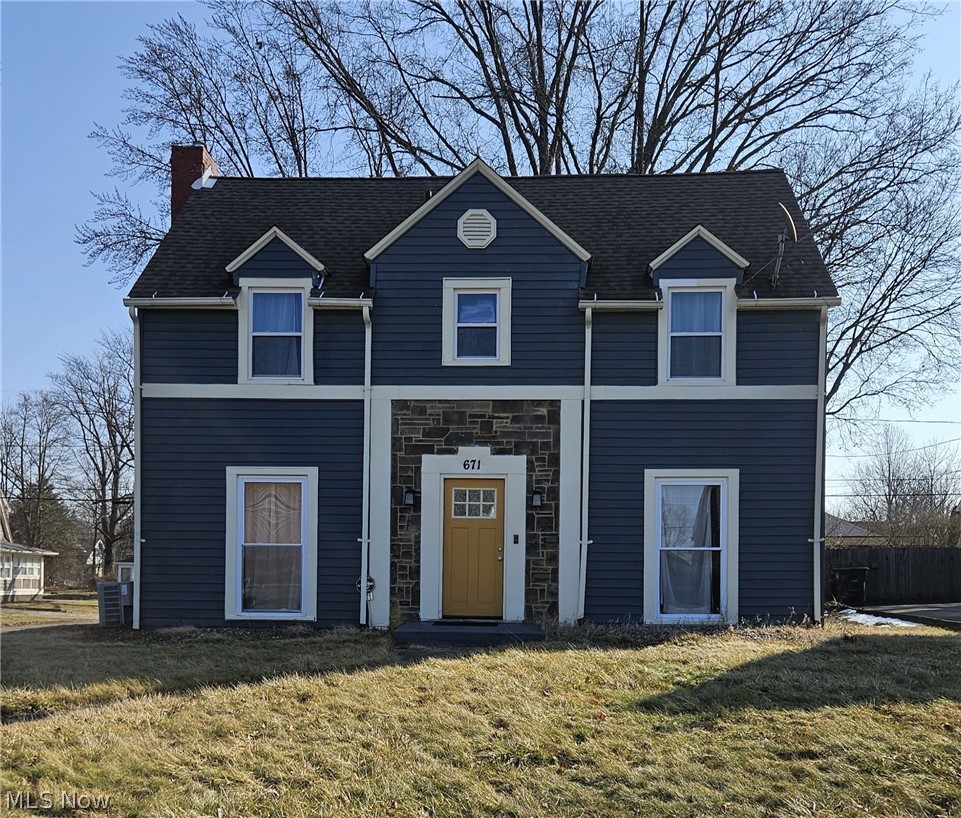 Take a look at this unique and colorful colonial located in West Akron! From the accented natural stone to the breeze filled back porch, this is the place to call home! The first floor boasts a half bath as you enter the back door and continue into an updated open kitchen, equipped with newer appliances, white cabinets and ample counter space for preparing any meal.  Holidays will be a hit here with a large adjacent dining room right off the kitchen! Enjoy a cozy book by the fireplace after dinner with the fireplace in the living room, and large built-in bookshelves. Still not relaxed enough? Enjoy going through the office and out the French doors to the sunroom, creating the perfect escape! The second story offers a large master bedroom with plenty of natural sunlight. Here you will also find a full bath with a built-in shelf for all your storage needs. Two additional bedrooms are located on the second floor. The basement has been maintained and cleaned so can be used for a multitude of purposes, including a laundry and utility area! Additionally, the hot water tank, furnace and A/C are newer and the electrical panel in the house and garage are updated as well. Outside you will find the firepit and large patio next to the 2 car detached garage. Located between Highland square and Interstate 77, you are just minutes away from shopping, restaurants, parks, and much more! With the warmer weather on the way, it’s a perfect time to Spring into action and schedule a showing!