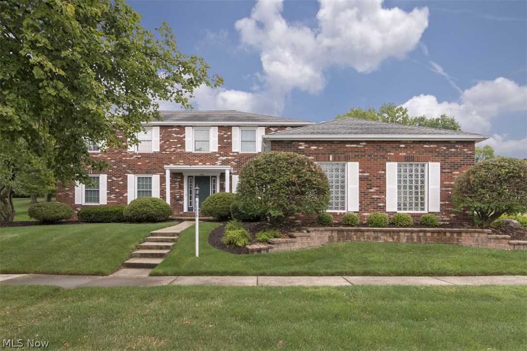 Move right in to this beautifully updated colonial that is convenient to everything you need in Garfield Heights! This all brick beauty features an updated kitchen, an open floor plan, and new flooring throughout. It is just waiting for you! As you step inside the two-story foyer, you will immediately feel like you are home. The living room is spacious and inviting with large windows and curved archways that open into the dining room. You will love the updated kitchen with an island, a breakfast bar, pendant lighting, all appliances, and an eat-in area that is open to the family room. The step down family room features a fireplace flanked by built-ins and patio access, so you can easily enjoy summer meals right outside. A convenient laundry room, a powder room, and a bedroom that is currently set up as an office complete the first floor. Upstairs, you will find four spacious bedrooms and two full bathrooms, including the master bedroom suite. The full lower level provides an abundance