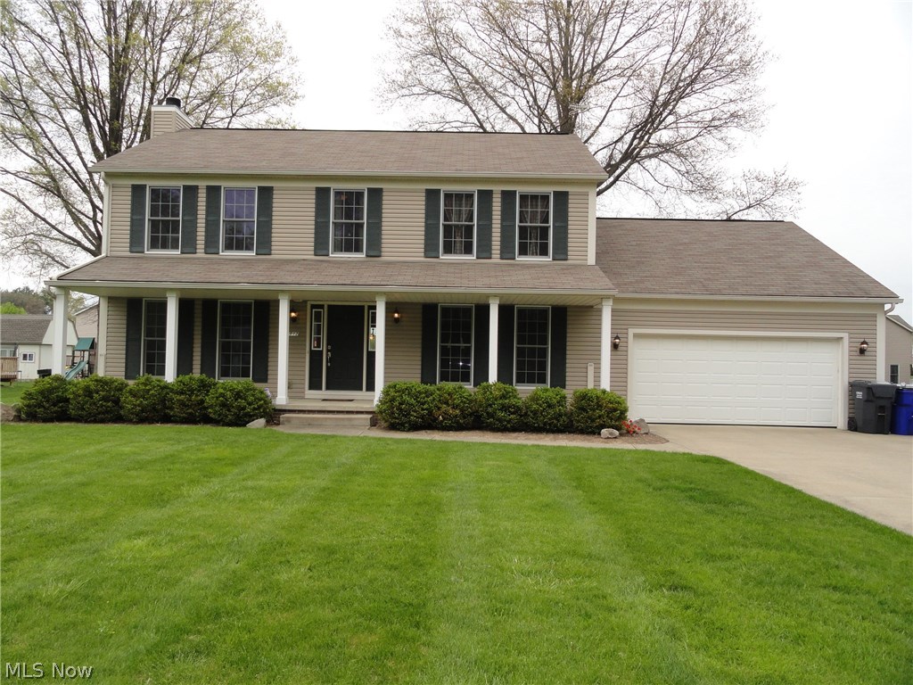 Sharp Colonial in The Meadows at Marsh Creek.  Welcoming porch steps into foyer entry with open staircase.  Spacious Great Room with wood-burning fireplace.  Recently updated beautiful kitchen with bay windows, black granite counters, tiled backsplash and ceramic tile floors.  First floor laundry, 1/2 bath, and formal dining room too!  Four bedrooms and 2.5 baths.  The master bathroom has a garden tub, separate shower, dual sinks and large walk-in closet.  The lower level offers an additional 500 square foot finished area done with professional quality.  Large stamped concrete patio overlooking the 1/2 acre lot, beautifully maintained and manicured to include a 12 x 16 shed.  The two car attached garage is insulated and extra deep with 8 additional feet.  Nice concrete driveway plus extra parking pad.  Water softener, central vac, security system, leaf filter, and more!  Updates include dishwasher in 2016, sump pump in 2015, water heater and refrigerator in 2014.  Don't wait!