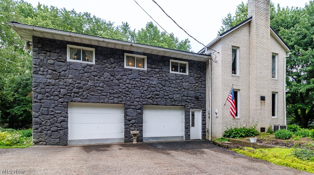 Big spaces, big potential, and a brand new metal roof! If you've been dreaming of putting your own stamp on a home, this is your chance. With 4 bedrooms, 2.5 bathrooms, and room to spread out, this home has the space you need and the opportunity to transform it into something truly special. It's ready for a fresh vision and a few updates to bring it up to 2026 standards, but the possibilities are endless. The main floor is built for gathering, featuring a huge open great room anchored by a beautiful stone fireplace, plus a spacious eat in kitchen with plenty of room for family meals, holiday baking, or entertaining friends. A convenient half bath rounds out the first floor. Upstairs, you'll find three generously sized bedrooms, a large full bathroom with a Jacuzzi tub and separate walk in shower, plus an oversized family room that opens onto a fantastic back deck. Whether it's movie nights, a playroom, home office, or game room, this flexible space can become whatever your lifestyle needs. The third floor offers a private retreat with an enormous primary bedroom and an oversized bathroom, giving you the perfect foundation for an incredible owner's suite. A basement laundry area, abundant storage, and a layout that's hard to find complete the package. The expensive part has already been started with a brand new roof. Now it's your turn to add the modern finishes, fresh style, and personal touches that will make this home shine. If you've been searching for space, character, and the chance to build equity while creating your dream home, this one deserves a look.