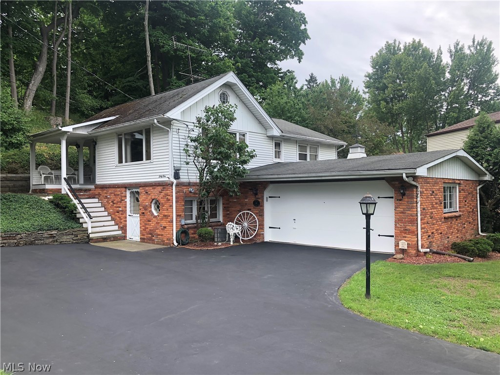 Attention Boaters or lovers of Lake Erie! Here is your chance to own a house in the quaint Chagrin Harbor Beach neighborhood. A year-round beachfront community with its own private beach club, clubhouse, playground and a short stroll to a large private neighborhood beach to watch gorgeous sunsets without owning an expensive lakefront house. The main floor of this unique hillside house includes 3 bedrooms, full updated bath, large eat-in kitchen with appliances and spacious living room. The lower-level walk-out basement boasts a large rec room with nature stone flooring, laundry area, a workshop with workbench and a cool retro family room with a built-in bar! Other features of the house include new carpeting (2022), freshly painted throughout (2022), an oversized insulated and heated 2 ½ car garage, a covered porch to enjoy the cool summer breezes, rear patio and a large drive way to park plenty of cars for all your shindigs! After you view the house, make sure you check out the ameniti
