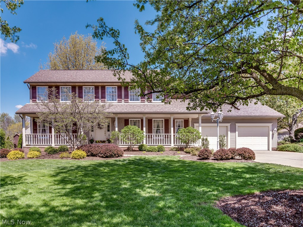 Welcome to Sutherland Cir, in Prestigious ST IVES. This Classic Colonial is every bit a Classic Home with its front porch.  Updated Kitchen and baths, along with an over sized 1st floor laundry room all with Granite Counters. From the moment you enter this inviting Foyer you are carried through out the home with tasteful decorating. From the Dining Room or Sitting Room, into the Family Room with an inviting fireplace,  with  a door that can either be open to have one large gathering place or keep as individual rooms.  This large eat-in kitchen has an island for all your gatherings. Off this amazing kitchen is a 3 season room which opens up to  a well manicured back yard.  There is a 1/2 bath off the kitchen, along with laundry room. Off the back hall you will enter a GARAGE to behold. With a 3 car garage. Yes this garage holds 3 cars .Impeccably clean garage will store your winter car as well, with plenty of storage,  Upstairs there is a Master Suite, with Master bath attached. Walk in