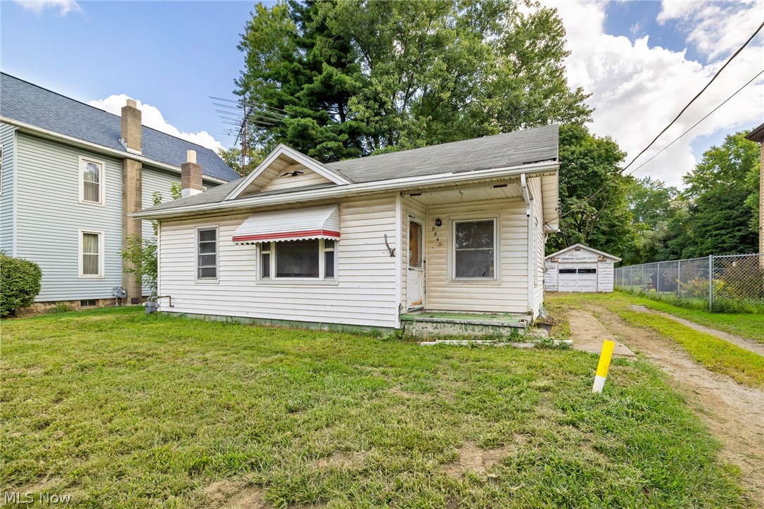 As-Is two bedroom ranch home with open concept kitchen and dining room. Plenty on natural light throughout the home. Country setting with a garage and an outbuilding.